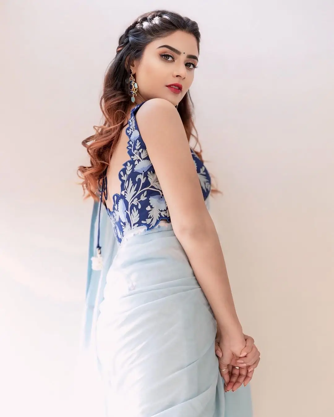 Priyanka Sharma Stills In Blue Saree Sleeveless Blouse